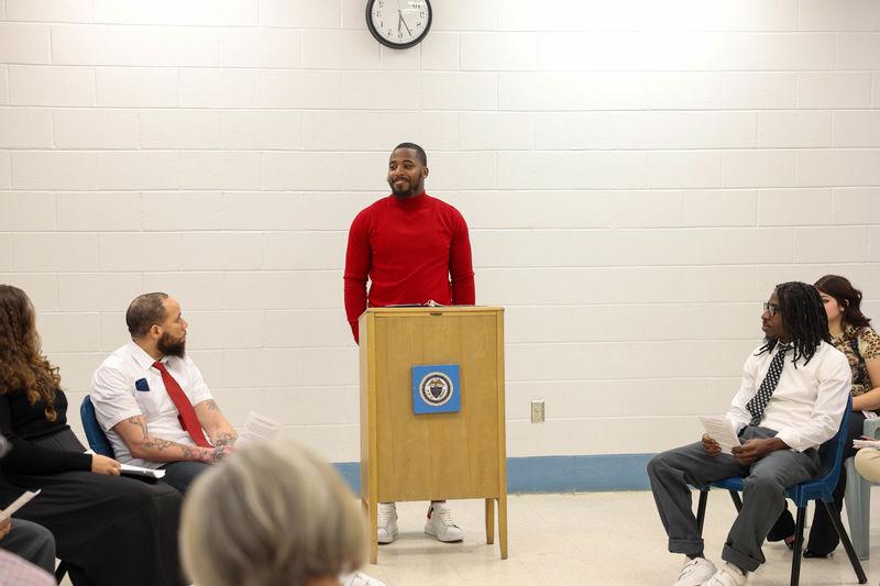 Sharif Smith standing at podium